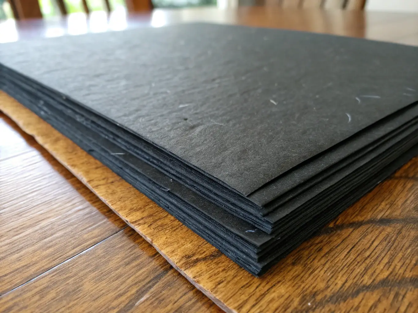 An image showing stacks of high-quality printing paper with a close-up of the paper texture.